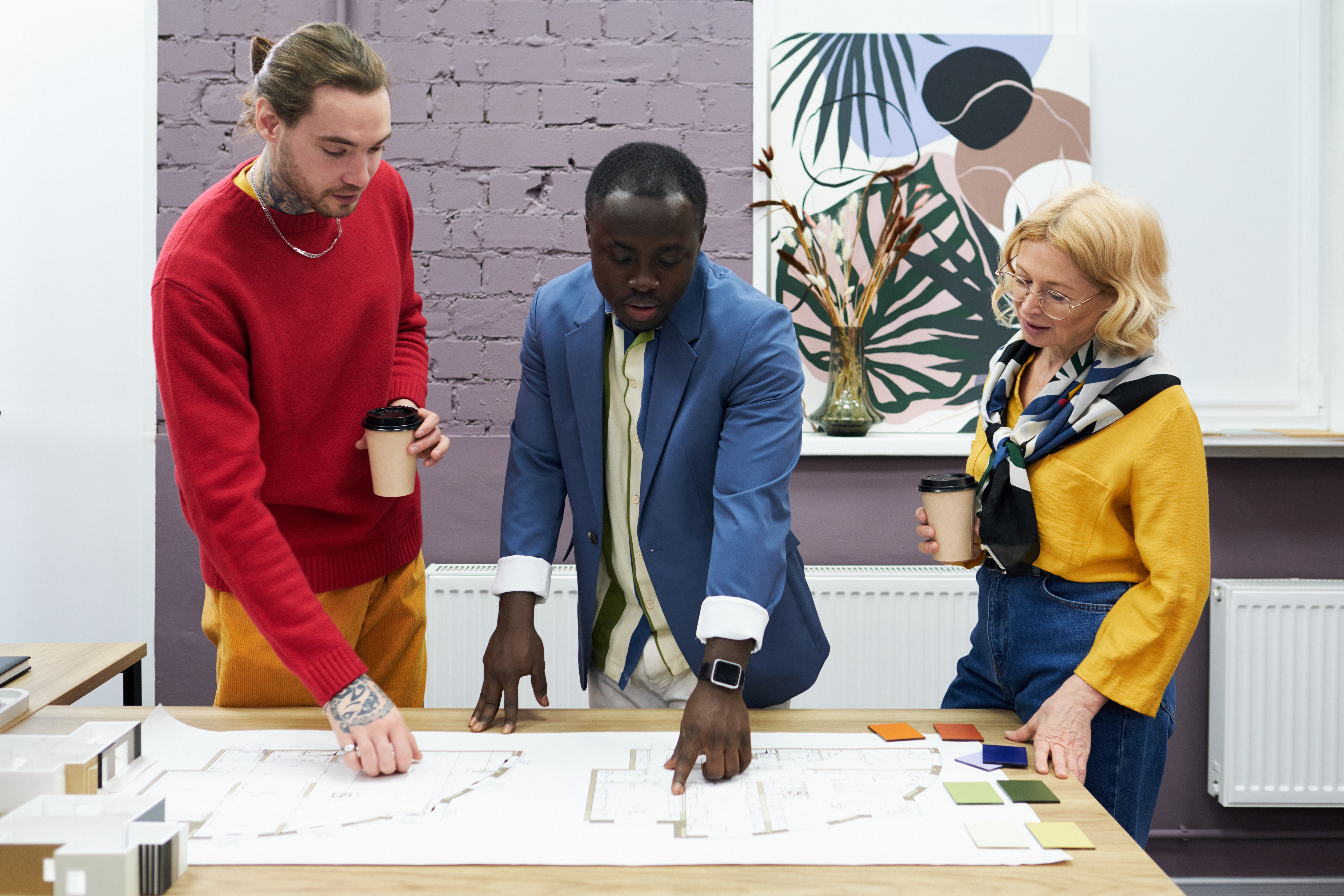 Architects collaborating around technical planning documents